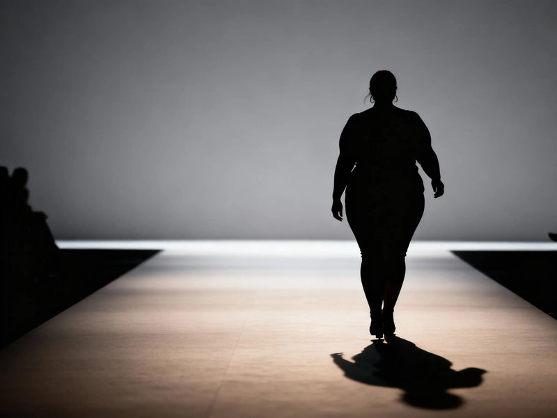 A plus sized model on the runway