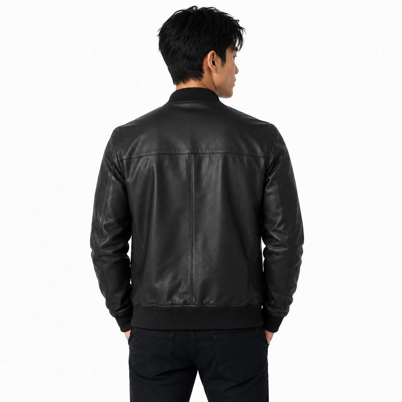 Person wearing a black leather jacket on a white background