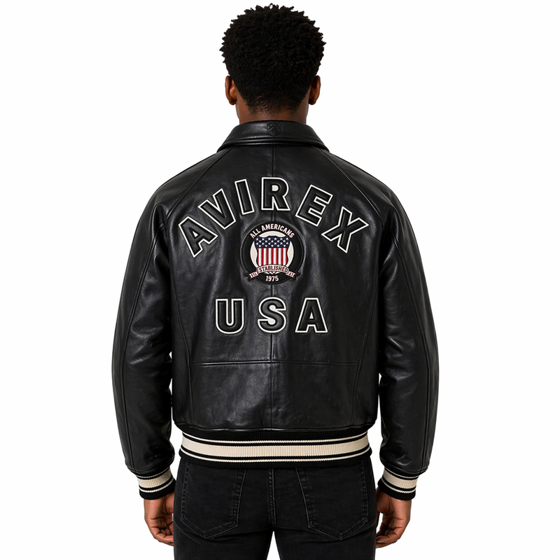 Man wearing a Avirex Real Leather Jacket, Black Flight Bomber, American Varsity Style | Black The Stitch Fit