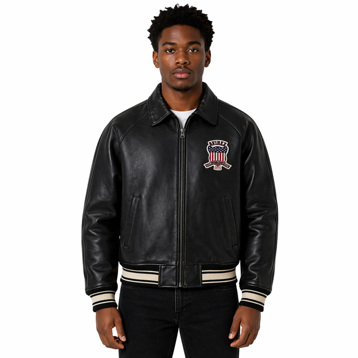 Man wearing a Avirex Real Leather Jacket, Black Flight Bomber, American Varsity Style | Black The Stitch Fit