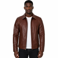 Man wearing a brown Harrington leather jacket on a white background